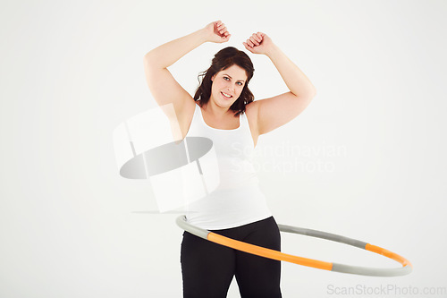 Image of Happy woman, portrait and hoop workout in fitness, exercise or balance on a white studio background. Active female person smile with plastic circle for training, health and wellness on mockup space