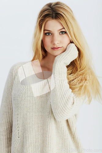 Image of Portrait, winter fashion and sweater with woman in studio on white background for comfortable style. Model, clothes and outfit with confident young person in warm clothing for cold weather season