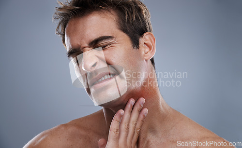 Image of Man, neck and red rash pain from razor burn for hair removal for hygiene maintenance, mistake or grey background. Male person, hand and unhappy in studio or care fail in inflammation, itchy or mockup