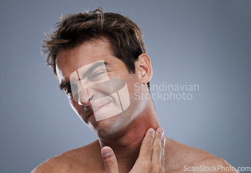 Image of Man, shave and beard rash from razor burn on grey background for skin care fail, itchy or hair removal. Male person, neck and red pain for healthy wellness or inflammation, studio or mockup space