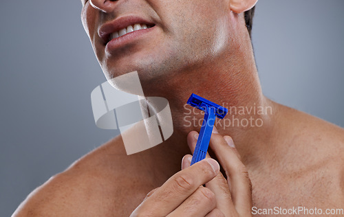 Image of Person, shaving and beard or razor burn for hair removal or red rash, inflammation or grey background. Hand, tool and hygiene mistake in studio or accident for wellness maintenance, pain or mockup