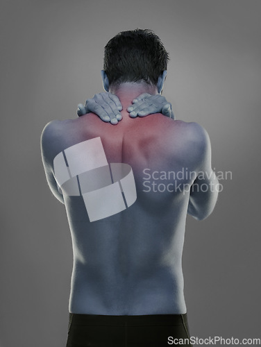 Image of Back, man and red highlight for neck pain, injury and muscle tension on a grey studio background. Person, guy and model with inflammation and body ache with bruise and broken with strain and burnout