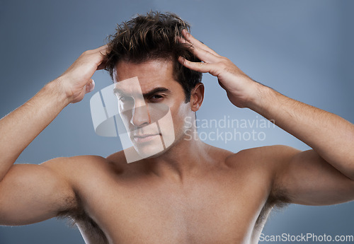 Image of Man, portrait and hairstyle with confidence in studio on grey background for wellness hygiene, application or grooming. Male person, face and healthy self care for morning routine, model or mockup