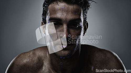 Image of Portrait, man and water with skincare, sweating and dermatology on a grey studio background. Face, person and purple liquid with hydration and beauty with morning routine, wet and luminescent with uv