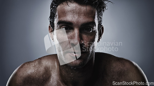 Image of Portrait, man and water with cosmetics, sweating and dermatology on grey studio background. Face, person and model with hydration and beauty with morning routine, wet and hygiene with skincare