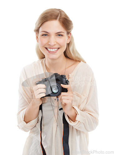 Image of Portrait, photographer and happy woman with camera in studio isolated on a white background. Face smile, paparazzi and dslr technology for hobby, taking pictures and creative professional photoshoot