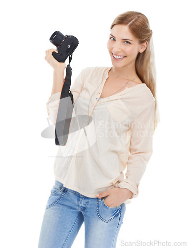 Image of Portrait, creative photographer and happy woman with camera in studio isolated on a white background. Confident person, paparazzi and technology for hobby, taking pictures or professional photoshoot