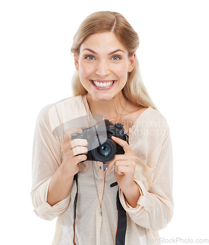 Image of Portrait, photographer and smile of woman with camera in studio isolated on a white background. Happy face, paparazzi and dslr technology for hobby, take pictures and creative professional photoshoot