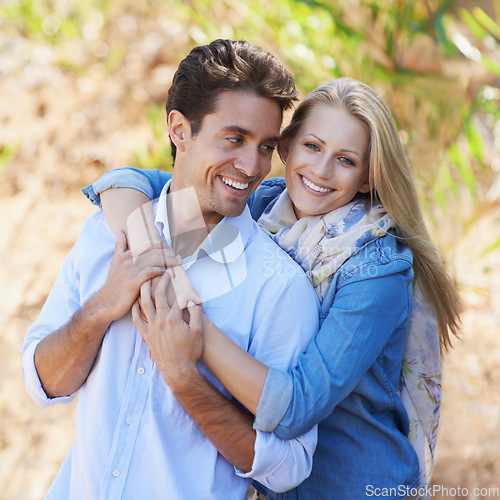 Image of Couple, portrait and happy or hug with travel in forest, nature or outdoor for holiday, vacation or trip. Romance, man and woman with embrace or smile for relationship, date or honeymoon with love
