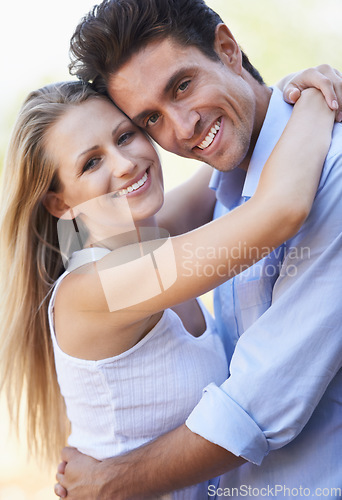 Image of Happy, young couple and portrait with hug in nature, bonding together and love in marriage with commitment. People, smile and face in embrace on outdoor break, relax and summer vacation for romance