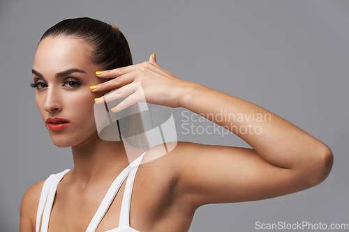 Image of Beauty, manicure and portrait of studio woman with facial cosmetics, skincare shine or nail paint treatment. Color, clean hands and cosmetology model with makeup glow on grey background