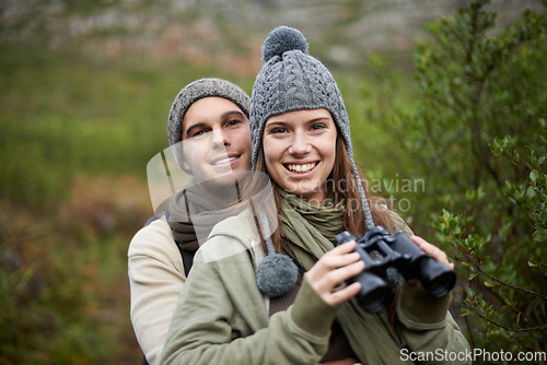 Image of Hiking portrait, binocular and couple smile for nature getaway, weekend break and camping retreat in eco forest. Sustainable woods, love and people bond on travel adventure, trekking or bird watching