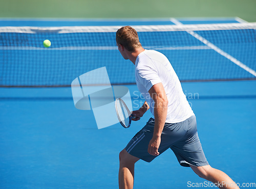 Image of Sport, man and tennis on court with fitness, competition and performance outdoor with serve and energy. Athlete, player and ball on turf for training, exercise and racket with skill, game or wellness
