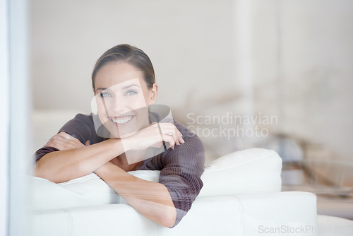 Image of Woman, relax and portrait in living room couch for positive, satisfaction and lounge. Happiness, calm and weekend with female person, home and joy, carefree and comfortable alone in sofa for rest