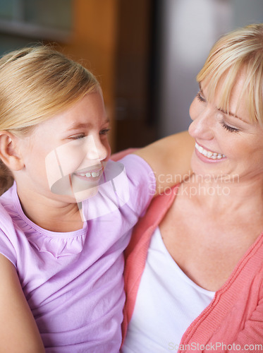 Image of Mother, girl and hug for bonding, happiness and love in childhood by single parent at home. Daughter, mommy and together in embrace, trust and support or security and enjoying connection and care