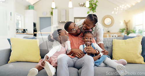 Image of Happy, black family on sofa and in living room of their home happy together for care. Support or love, happiness or positivity and African people cuddle on couch in their house for bonding time