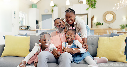 Image of Happy, black family on sofa and in living room of their home happy together for care. Support or love, happiness or positivity and African people cuddle on couch in their house for bonding time