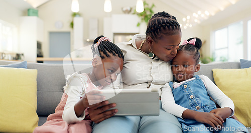 Image of Happy, mother with her child and tablet on sofa in living room of their home together. Technology or connectivity, happiness or kissing and black family on couch streaming a movie in their house
