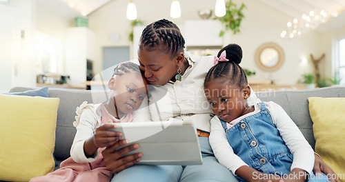 Image of Happy, mother with her child and tablet on sofa in living room of their home together. Technology or connectivity, happiness or kissing and black family on couch streaming a movie in their house