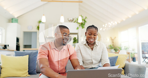 Image of Technology, married couple celebrating and laptop on a sofa in living room of their home. Social media or online communication, success or high five and black people together happy for connectivity