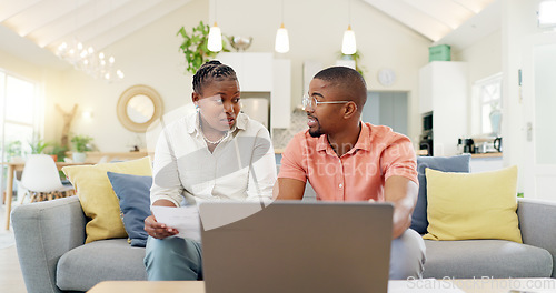 Image of Finance, documents and couple with laptop on sofa with bills, paperwork and insurance budget. Financial planning, mortgage and black man and woman on computer for pension, tax payment or investment