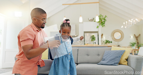 Image of Black family, education and girl with backpack for school, kindergarten and high five from dad for support and motivation. Child, student and father helping to get ready and leave house in morning