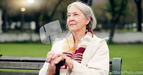 Image of Relax, thinking and a senior woman at the park for summer, ideas or retirement vision. Smile, remember and an elderly person on a bench in nature with inspiration, memory or outdoor reflection