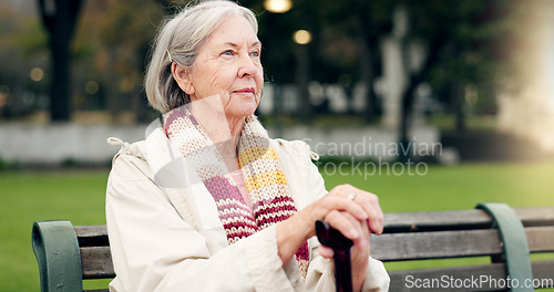 Image of Relax, thinking and a senior woman at the park for summer, ideas or retirement vision. Smile, remember and an elderly person on a bench in nature with inspiration, memory or outdoor reflection