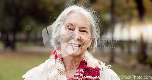 Image of Senior woman with a smile, portrait in the park and happiness in nature, woods or outdoor for a walk in retirement. Happy, face and elderly person with wellness from exercise or healthy workout