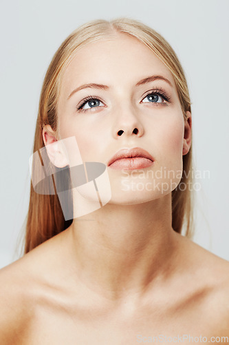 Image of Woman, face and thinking for beauty and natural skincare in studio, headshot for wellness and dermatology on white background. Ideas, inspiration and thoughtful model, clean makeup and cosmetics