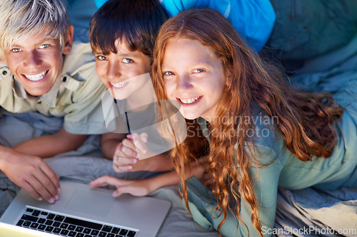 Image of Children, portrait and relax with laptop on floor together with happiness and online games for holiday or vacation. Kids, smile and playing with computer on website, streaming or search on internet