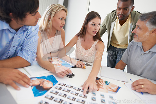 Image of Design, meeting and people planning with magazine, photoshoot and review of photography editing process. Office, table and team talking about print, results and decision for production of catalog