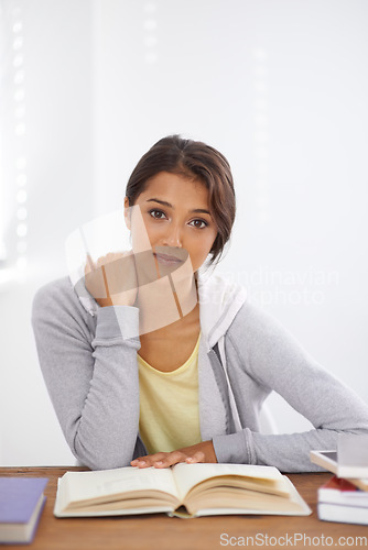 Image of Portrait, books and woman studying at desk in college, learning and reading for school project. Face, notes and young student at table for education, knowledge and scholarship in university in Brazil