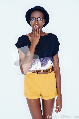 Image of Portrait, fashion and wow with hipster black woman in studio on white background for reaction or alert. Surprise, shock or omg and young person in glasses with wtf emoji or facial expression