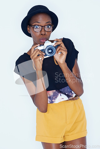 Image of Woman, shocked and photographer in portrait in studio, creativity and talent for artist in creative job. African person, design or face in photoshoot by camera or surprise by lens on white background