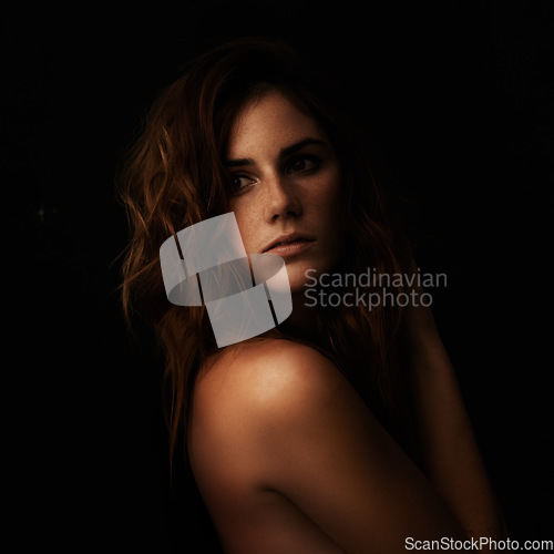 Image of Woman thinking, body and skincare in studio for cosmetics, dermatology and shadow or light for art deco and aesthetic. Beauty model or person with self care and sensual on a dark or black background