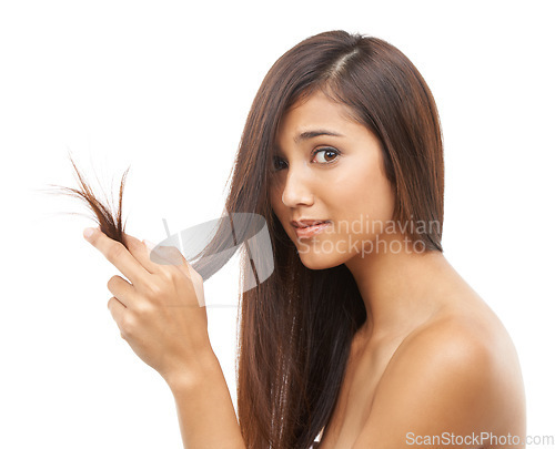 Image of Hair, woman and stress in studio with portrait for shampoo texture, treatment damage and keratin hairloss. Model, face and frustrated with split end, cosmetics and hairstyle on white background