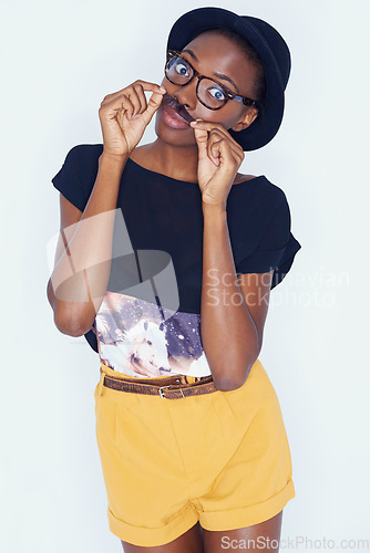 Image of Portrait, funny and black woman with fashion, moustache or stylish clothes on white studio background. African person, model and girl with glasses and casual outfit with gen z or funky with aesthetic