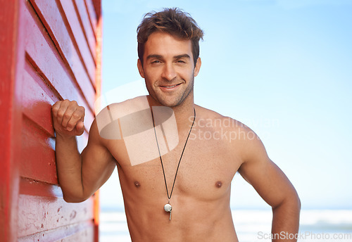 Image of Happy man, portrait and lifeguard on beach for rescue, bay watch and security or outdoor swimming in health and safety. Face of male person or professional swimmer smile in fitness for patrol at sea