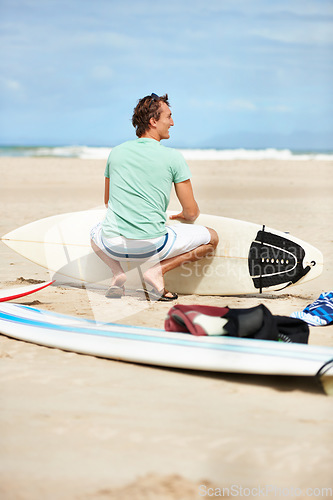 Image of Surfing, nature and man with surfboard on beach for water sports training, wellness and fitness by ocean. Travel, waves and back of happy person for adventure on holiday, vacation and hobby by sea