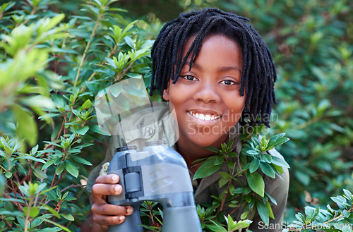 Image of Nature portrait, binocular and black child happiness for travel adventure, outdoor exploration or bird watching trip. Tree leaf, face or African kid on search journey in forest, woods or eco jungle