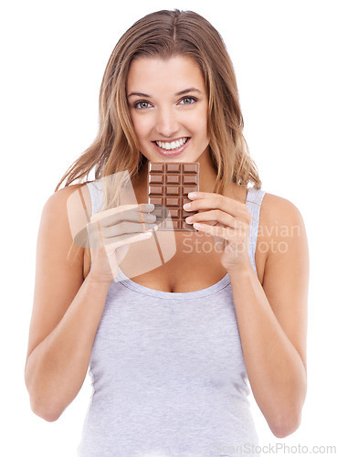 Image of Woman, eating chocolate and portrait with candy, face and pleasure for craving sugar in white background. Happy, snack and smile for comfort, dessert or sweets for calories, diet or tempting
