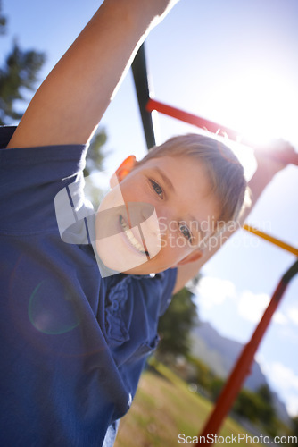 Image of Child, monkey bars and smile in portrait, hanging game and obstacle course on outdoor adventure at park. Male person, active and exercise on jungle gym, boy and fitness on playground in Australia