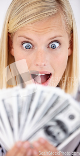 Image of Excited, woman wow and money with dollars, investment and savings for budget with reward. Wealth, wondering and happy person smile with cash profit from work bonus in studio with white background