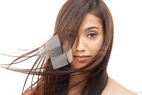 Image of Hair care, woman and portrait or confident in studio with keratin treatment, soft texture and beauty shine. Model, Indian girl and face with hairstyle, cosmetics and collagen glow on white background