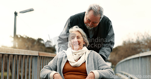 Image of Senior couple, nature and in a wheelchair on a walk for happiness, retirement date or love. Smile, talking and an elderly man and woman with a disability and in a park to relax together in marriage