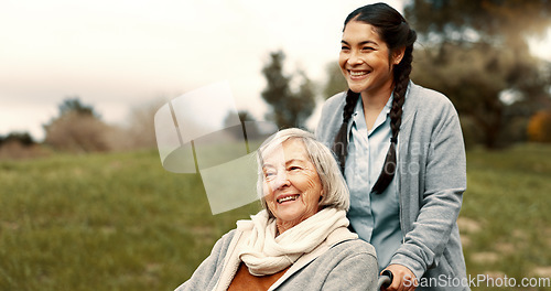 Image of Happy, senior woman and outdoor with caregiver, nurse or healthcare service for person with a disability and wheelchair. Face, smile and elderly lady in park with care or support in retirement