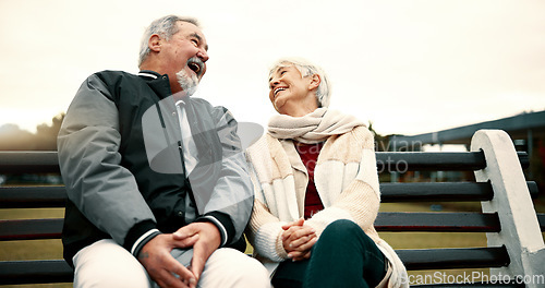 Image of Retirement, laugh and Senior couple on bench at park with happiness or bond for quality time. Love, happy face and elderly woman or man in nature with support or embrace for trust or laugh together.