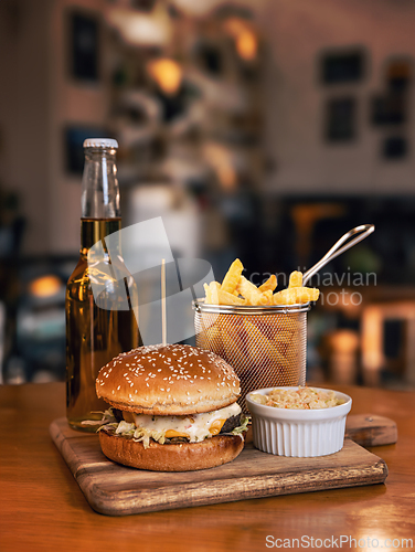 Image of Juicy hamburger served with fries