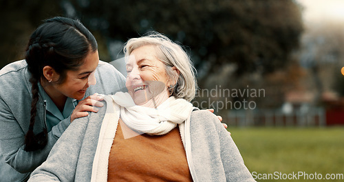 Image of Caregiver helping woman with disability in park for support, trust and care in retirement. Nurse talking to happy senior patient in wheelchair for rehabilitation, therapy and conversation in garden